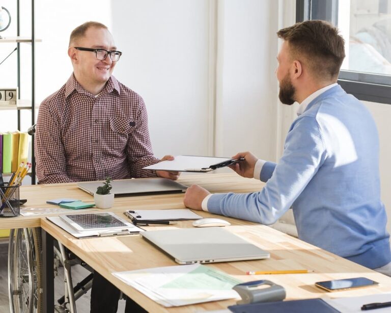 adult-men-working-together-office