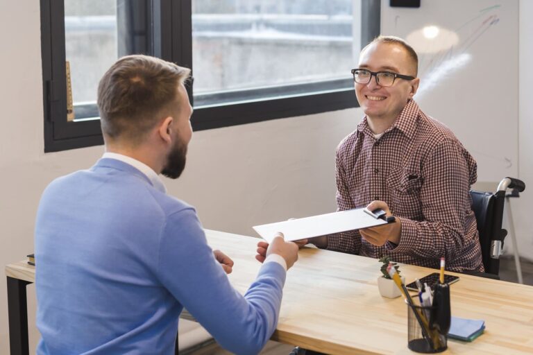 manager-congratulating-disabled-worker (1)